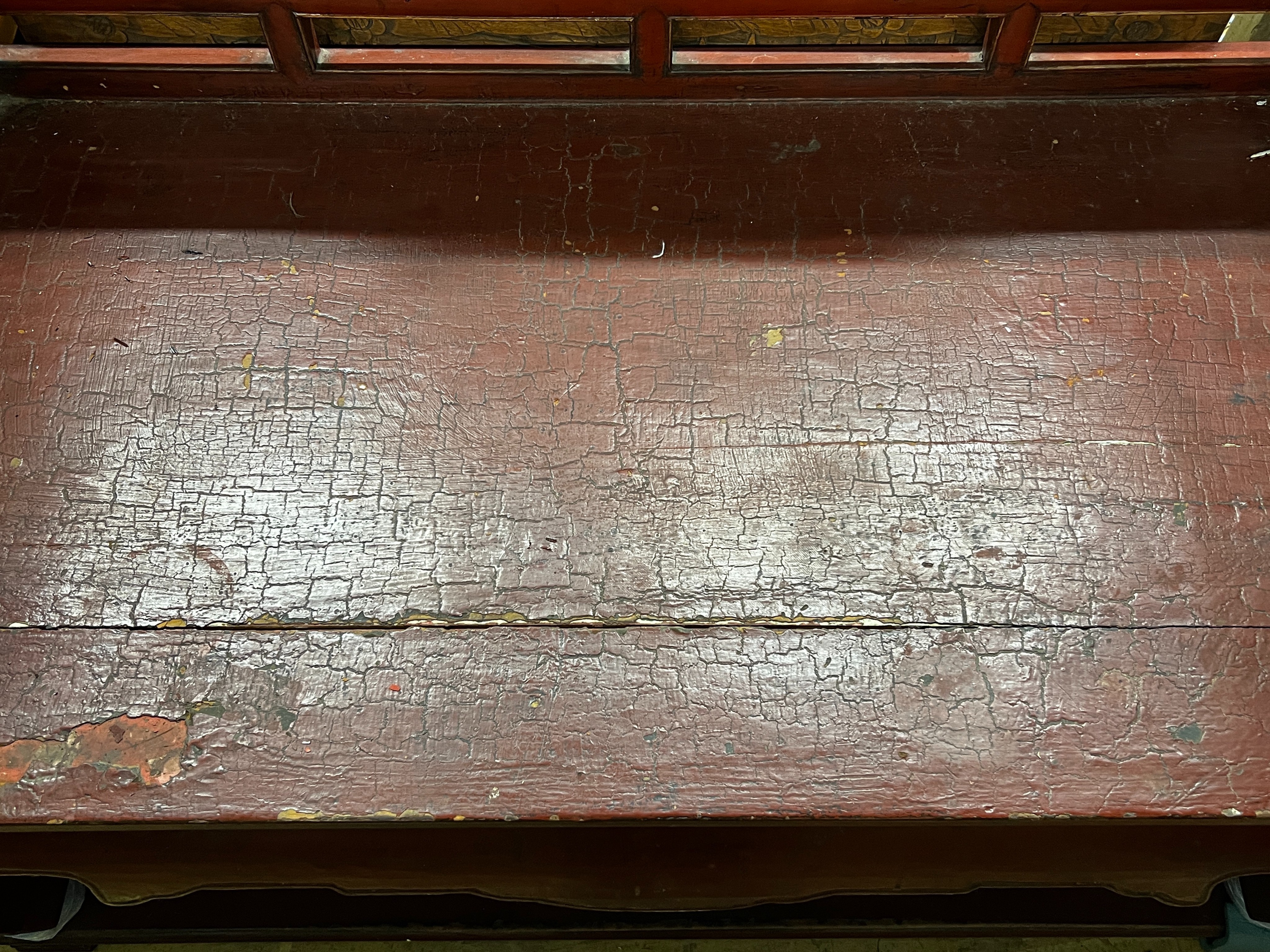 A Chinese scarlet lacquer parcel gilt bench, length 125cm, depth 70cm, height 97cm